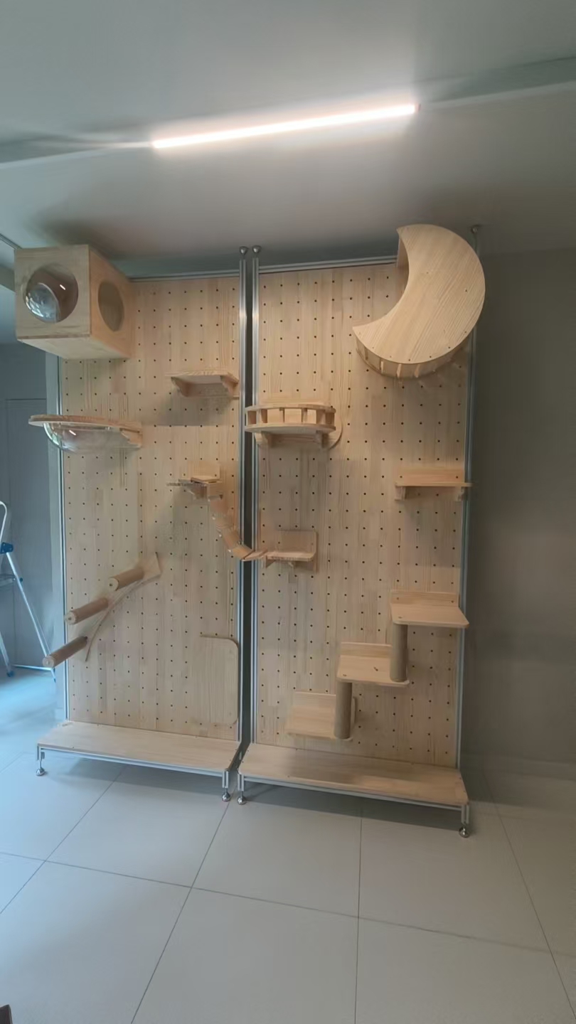 Wall-mounted wooden cat climbing wall with steps and perches installed by The Good Guys Singapore.