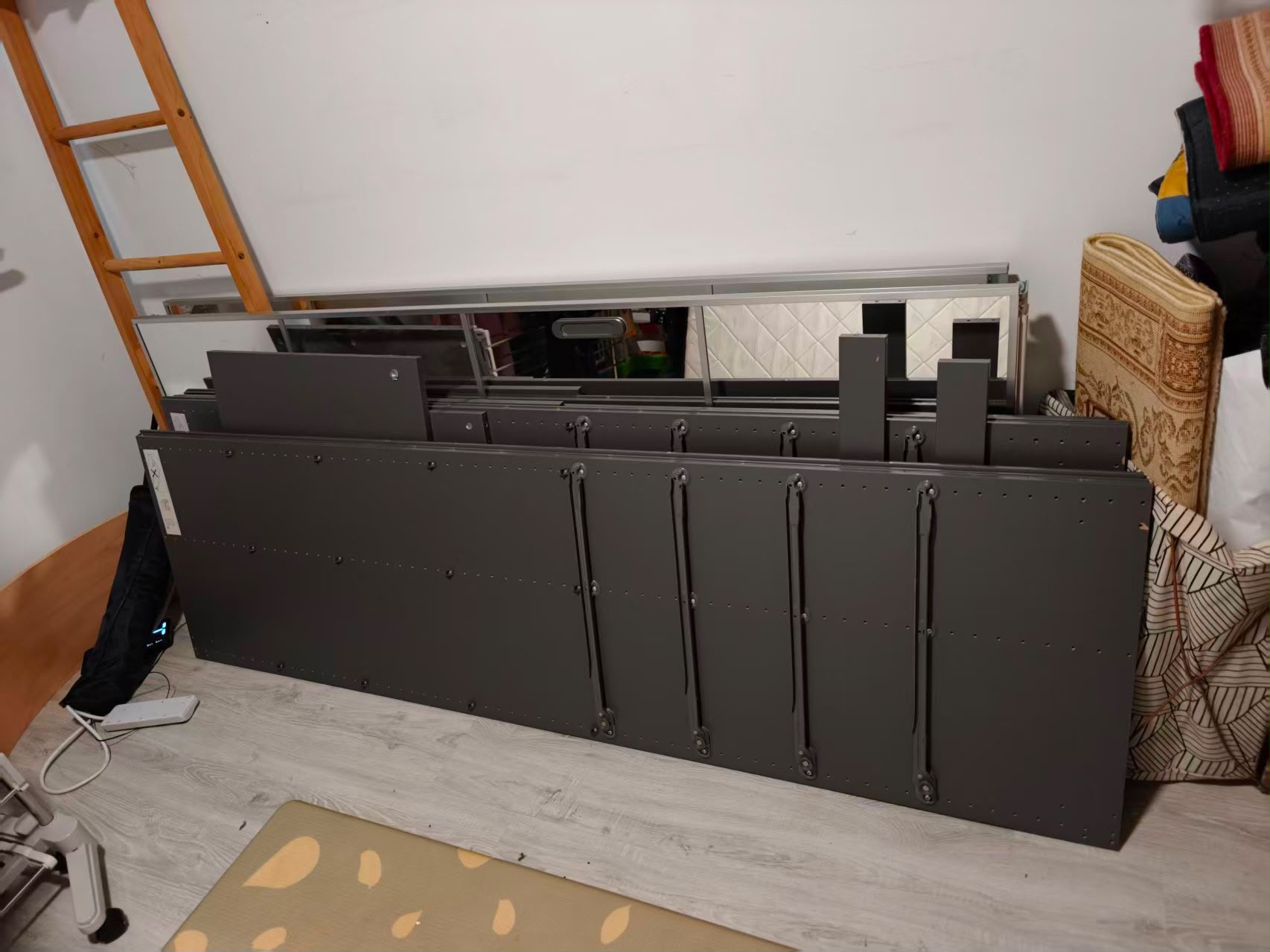 Wardrobe panels and doors dismantled and stacked for relocation by The Good Guys Singapore.