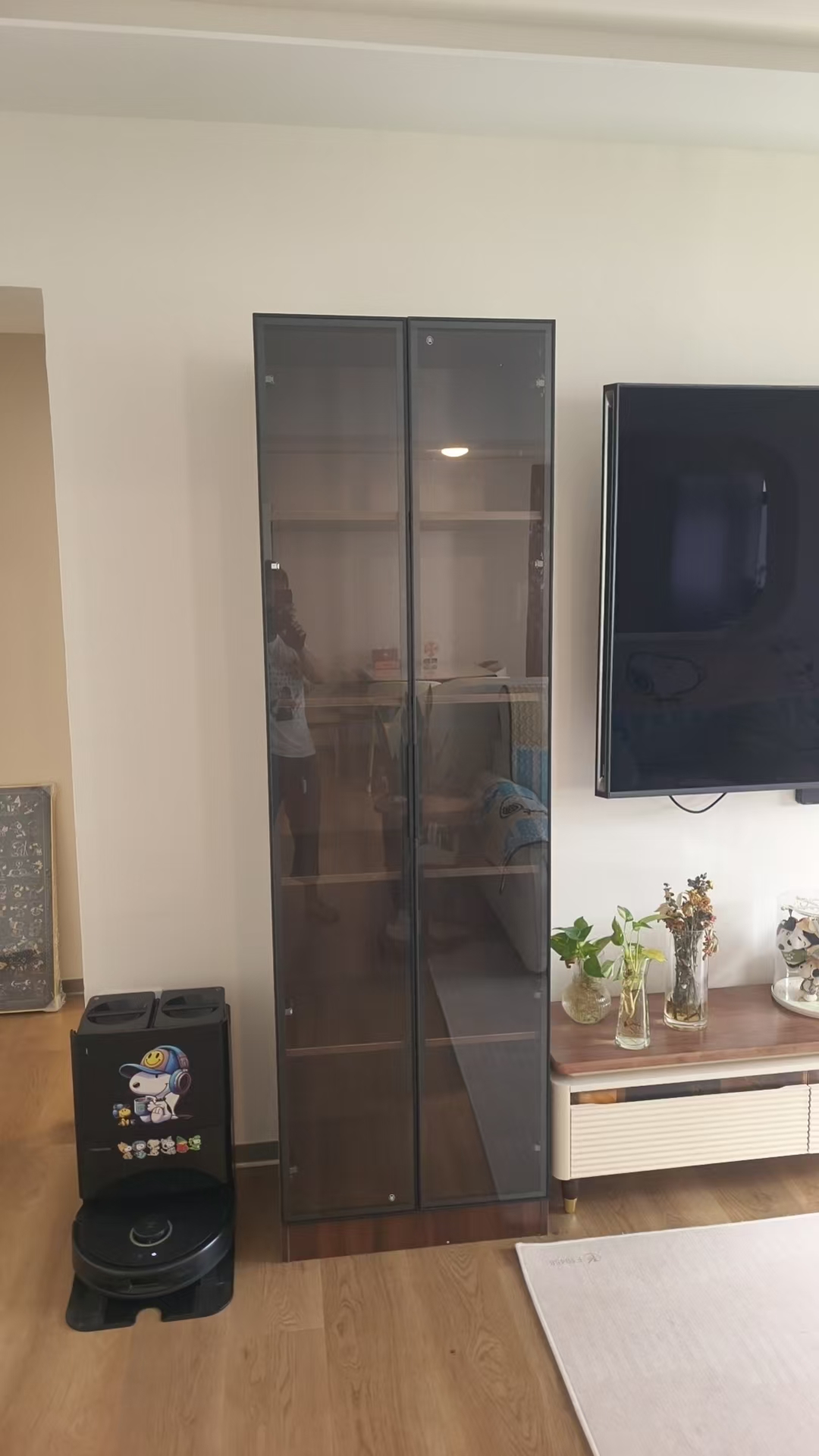 Tall storage cabinet with glass doors assembled by The Good Guys Singapore.