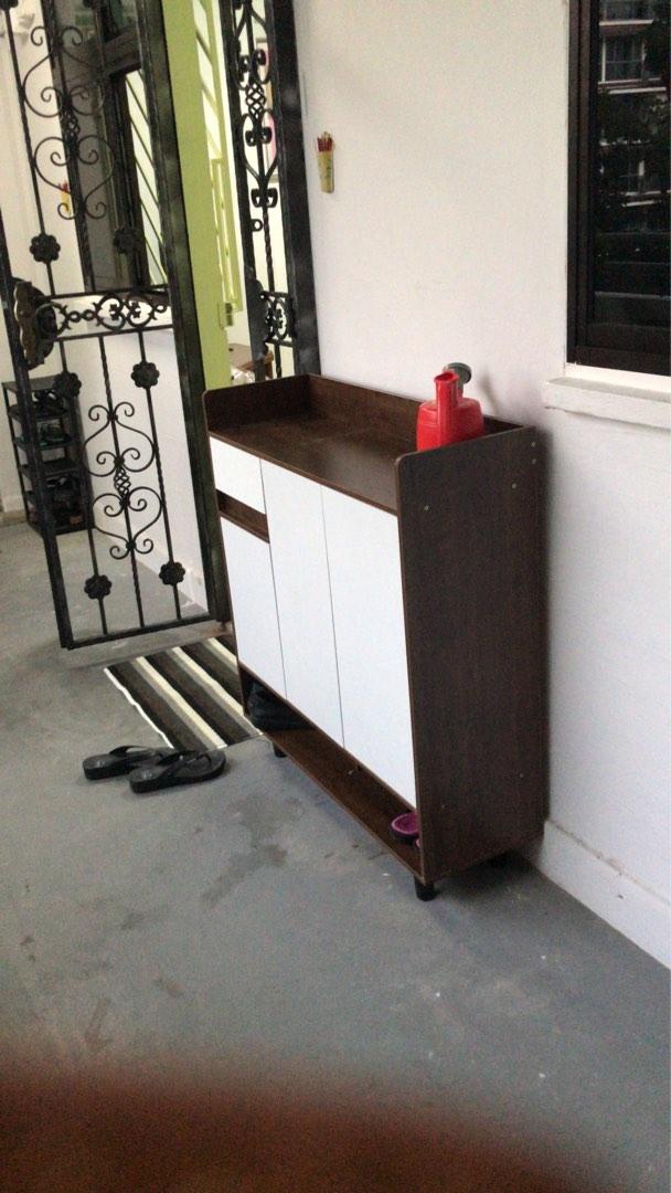 Brown and white shoe storage cabinet assembled by The Good Guys Singapore.