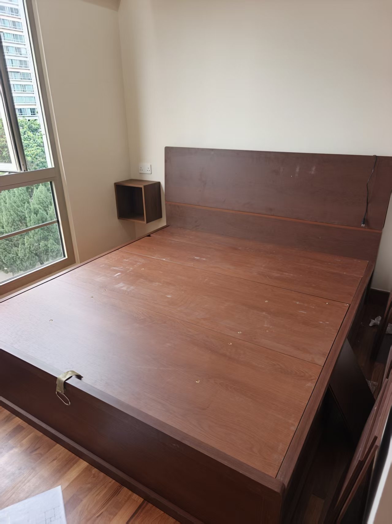 Dark wood platform storage bed with headboard assembled by The Good Guys Singapore.