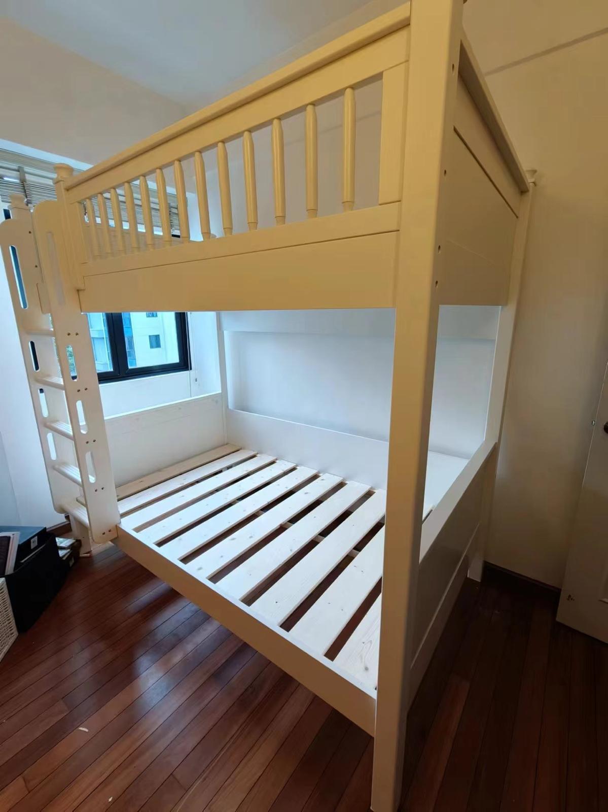 Full-height wooden kids bunk bed with ladder and safety rails assembled by The Good Guys Singapore.