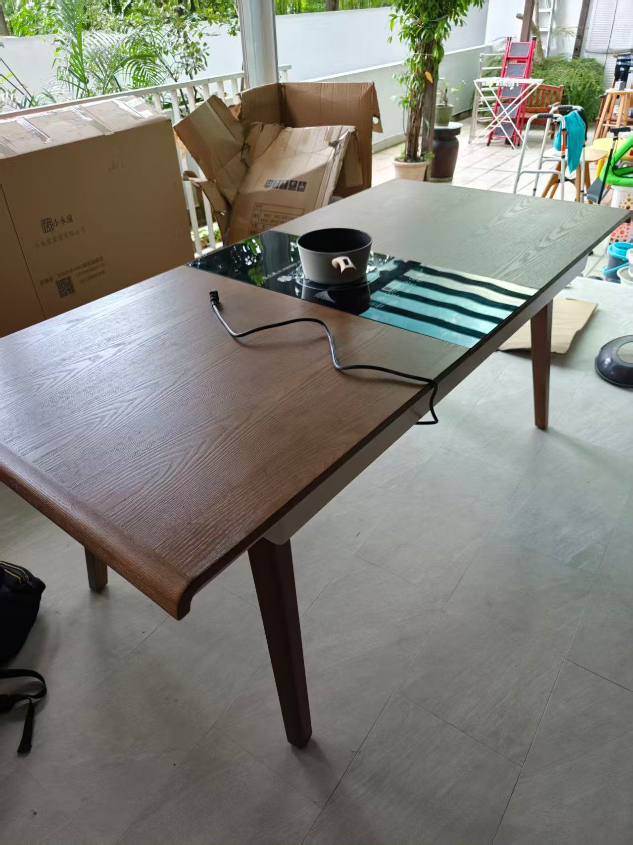 Brown extendable dining table assembled by The Good Guys Singapore.