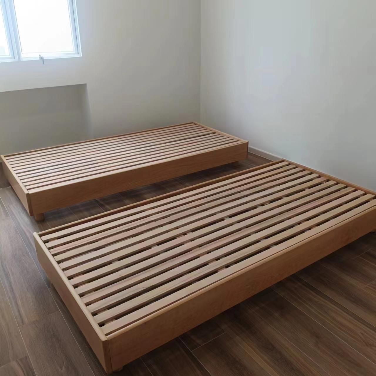 Low wooden slatted platform bed frames assembled by The Good Guys Singapore.