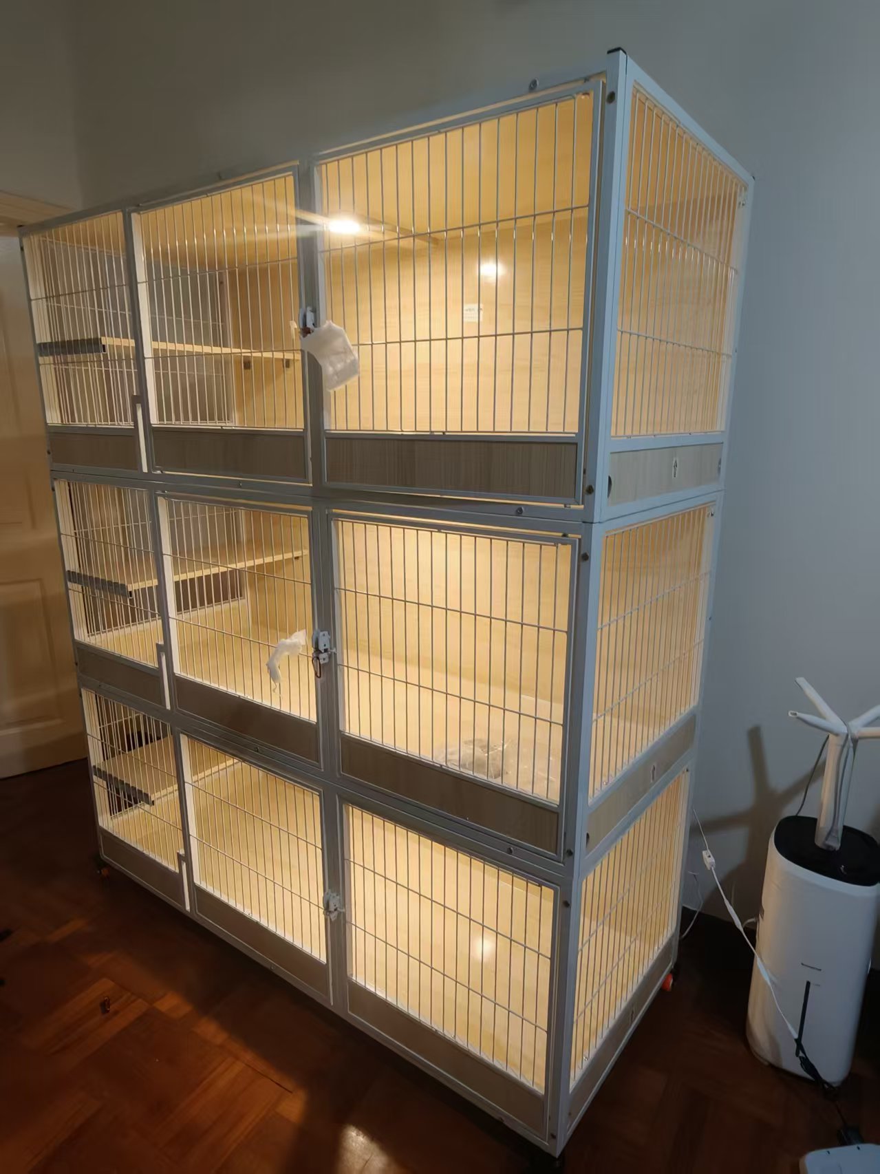Three-tier multi-compartment pet enclosure assembled by The Good Guys Singapore.