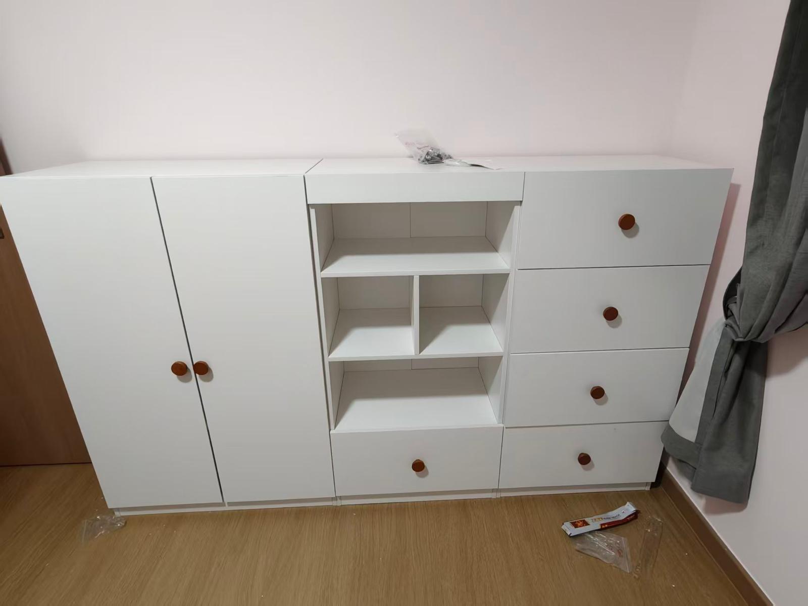 White storage cabinet with open shelving, cupboards and drawers assembled by The Good Guys Singapore.