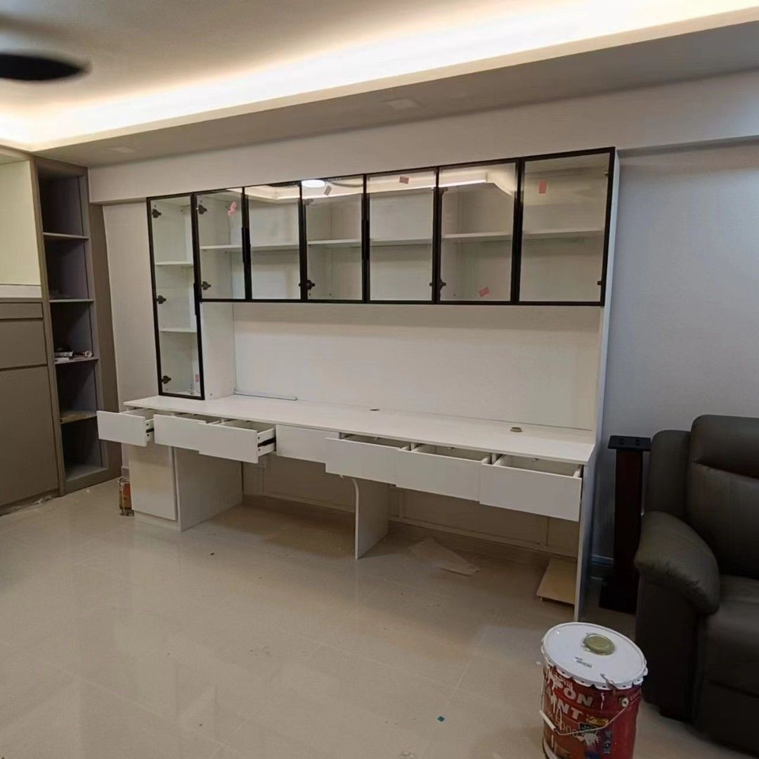 Long study desk with drawers and overhead display cabinets assembled by The Good Guys Singapore.