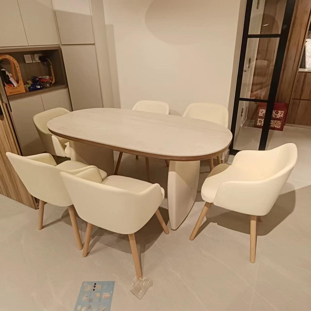 Dining table with six upholstered chairs assembled by The Good Guys Singapore.
