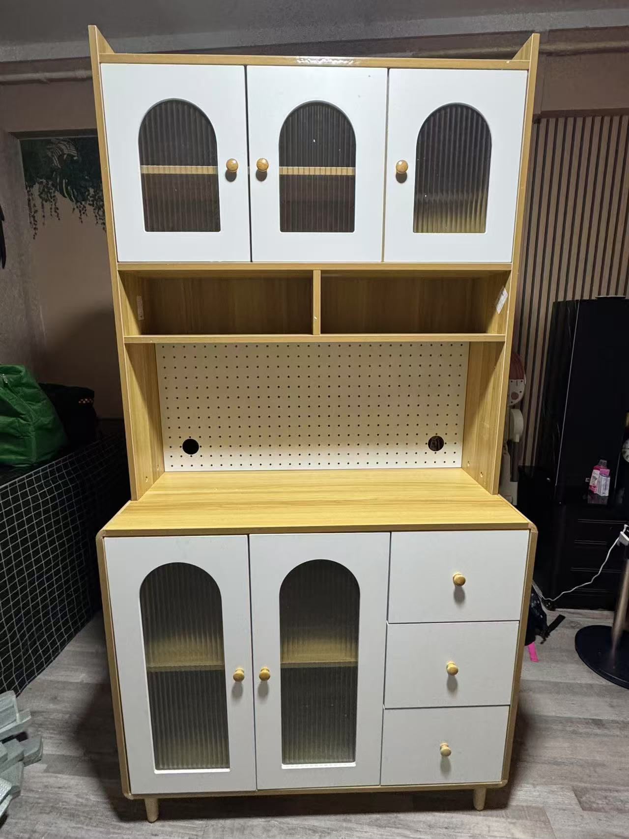 Tall kitchen storage cabinet with display doors and drawers assembled by The Good Guys Singapore.