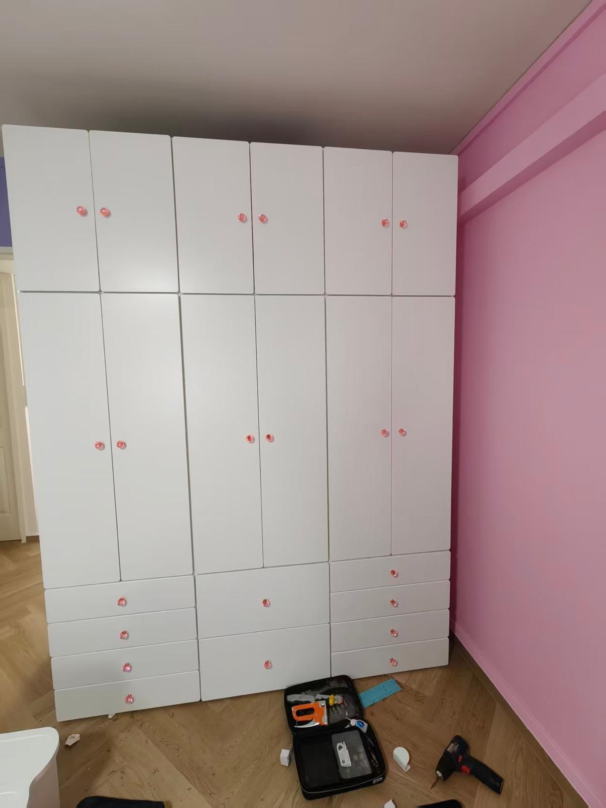 Full-height white multi-section wardrobe with drawers assembled by The Good Guys Singapore.
